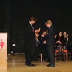 prep school student receiving award on stage