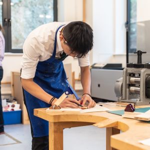 student working on a table