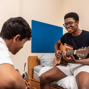 boys playing the guitar