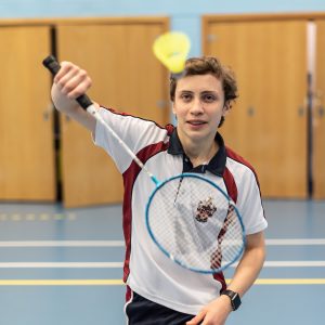 student playing badminton