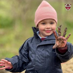 girl with a muddy hand