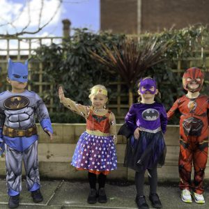 children in superhero costumes