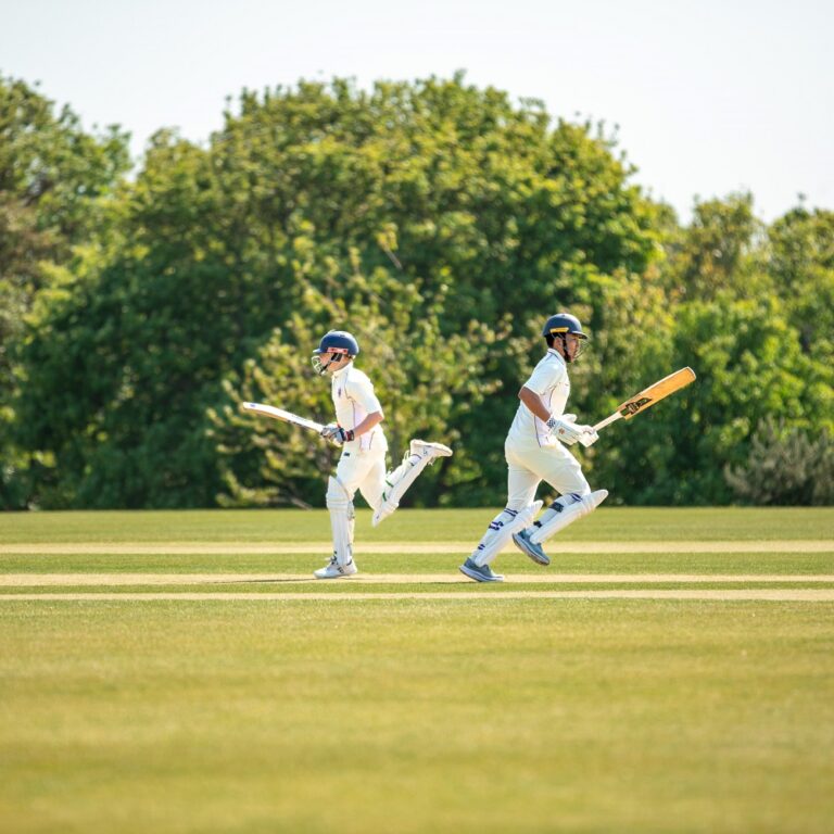 boys playing cricket