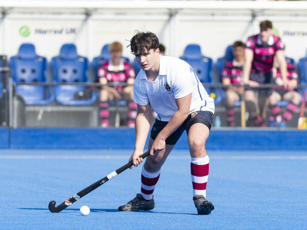 Student playing hockey for St Lawrence College